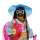 Barbie Extra Fly Barbie am Strand, gekleidet in buntem Glitzer-Outfit und coolen Accessoires.